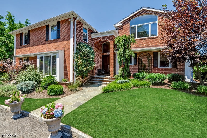 Pristine 5 Bedroom Colonial, w/1st Floor Guest Bedroom/Office. Just under 3/4 of an acre on prestigious Hartshorn Drive. Large family room w/built-ins, wood-burning fireplace, French doors leading to bluestone patio.  Wet-bar w/quartzite counters and wine refrigerator.  Living room accesses upper patio through French doors, Jerusalem stone surrounds wood-burning fireplace. Spacious kitchen w/10 foot granite island, stone floor and stainless steel appliances. Large master suite, adjacent sitting room, 2 walk-in closets and a luxurious bathroom. Ideal flow for indoor and outdoor entertaining.  Expansive level backyard.  Fireplaces, flues and chimneys are being                                                                                         sold "AS IS" with no known defects.  TAX APPEAL IN PROGRESS