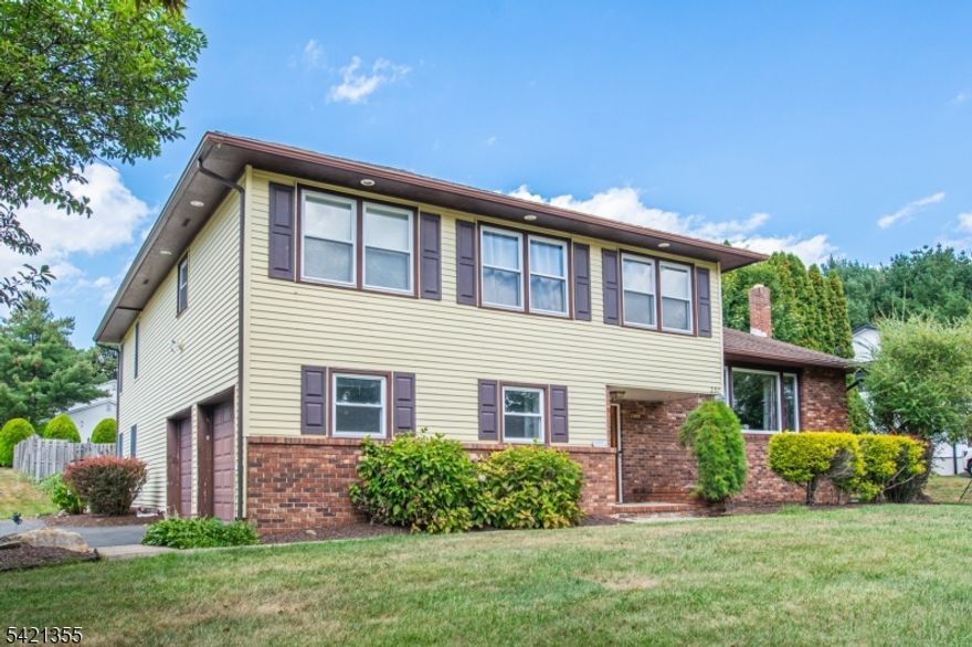 Expanded custom split-level home set on a park-like 3/4 acre lot features 4 bedrooms, 3 full baths, and an open floor plan designed for comfortable living and entertaining. A spacious entry foyer sets the tone for the homes generous room sizes. The 1st floor offers a bright living room, dining room, and updated kitchen with breakfast bar, granite countertops, and stainless steel appliances. The family room offers tile flooring and track lighting, and the sunny recreation room features sliding doors leading to the patio and backyard. Upstairs, the large primary suite includes a tray ceiling, two walk-in closets, and an updated bath. Three additional spacious bedrooms, and convenient second-floor laundry complete the second level. Additional highlights include a finished basement with office and storage space, a 2-car garage, new composite deck with vinyl railing, paver patio, and an in-ground pool. House faces Eyland, but driveway is on Alcott Way. Don't miss this opportunity to make it yours!