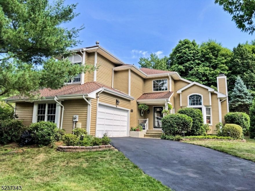 This stunning four-bedroom, three full-bath home is bathed in natural light and ideally situated on a peaceful cul-de-sac. Offering a perfect blend of modern comfort and versatile floor-plan, the first floor features a convenient bedroom, full bath, and laundry room. The updated kitchen is a chef's delight, complete with stainless steel appliances and tasteful finishes. Entertaining is effortless in the elegant dining room, while the inviting family room and living room both with cozy wood-burning fireplaces create the perfect spaces to relax. Hardwood floors throughout the first level add warmth and sophistication. Step outside to a private backyard, ideal for unwinding or entertaining. A two-car garage provides ample storage and convenience. Upstairs, the luxurious primary suite features an en-suite bath and walk-in closet. Two additional bedrooms and a beautifully updated full hall bath complete the second floor. Conveniently located near major highways, NYC bus and train lines, and top-rated schools. Enjoy "The Hills  community amenities, including a pool, clubhouse, fitness center, tennis courts, and playground. Available July. Lease application, NTN report, credit report, income verification, and renter's insurance are required. Tenant is responsible for lawn maintenance, snow removal, garbage, recycling, and the first $100 of repairs.