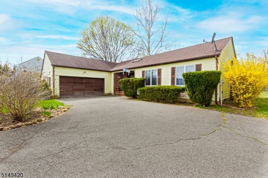 This light & bright 3-bedroom,2 full bath ranch has much to offer! The sun filled dining room with wall of windows is open to the living room with gleaming hardwood floors, fireplace and sliders to an entertainment size deck with views of the beautifully landscaped park like property. A Large Master Bedroom with full bath, 2 Additional Bedrooms & Bathroom. Located near the park, school, fine dining, shops and major roadways, make this home a truly must see!