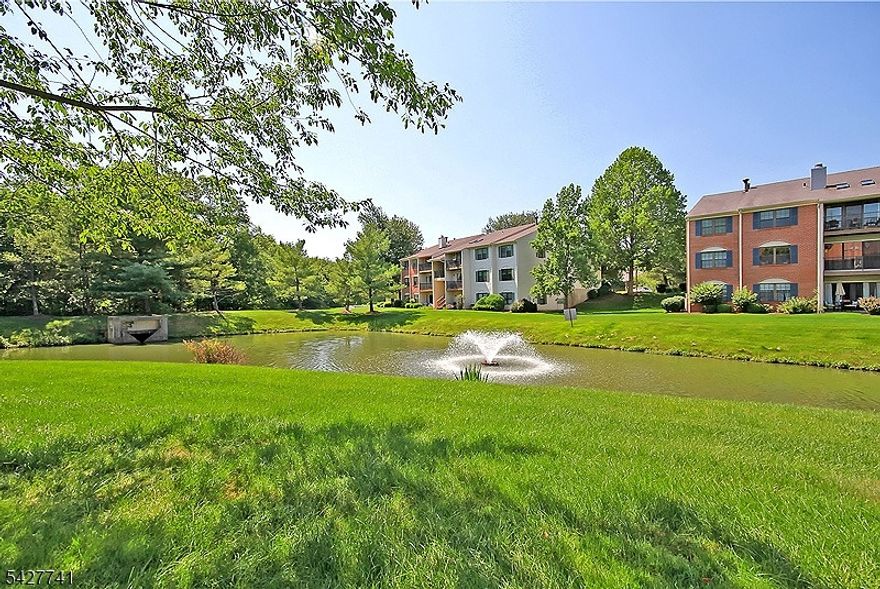 Step into this meticulously maintained, with some updates, 2-bedroom, 2-bathroom condo, perfectly positioned in Society Hill. Enjoy serene pond views from your private patio, seamlessly accessible from the spacious living room ideal for relaxing or entertaining. The eat-in kitchen features wood cabinetry, granite countertops, including a custom breakfast bar and a functional layout. A separate formal dining room adds elegance and versatility to your living space. The expansive primary suite offers a walk-in closet and an en-suite bath, while the second bedroom also includes a large closet and a hallway full bathroom. A convenient utility room houses a full-size washer and dryer. Additional perks include ample guest parking, one assigned parking spot, and a prime location close to shopping, major highways, and NYC-bound Midtown Direct trains. Nestled within a manicured 43-acre community near Pleasant Valley Park, Society Hill offers exceptional amenities including a clubhouse, in-ground pool, tennis and bocce courts, basketball court, and scenic bike paths. Located in the highly-rated Bernards Township school district, with professional property management for peace of mind. Don't miss this rare opportunity to enjoy low-maintenance living in a vibrant and amenity-rich neighborhood.
