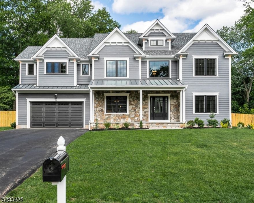 Experience the epitome of luxury living with this custom new construction home in Basking Ridge, featuring 6 bedrooms and 6.5 baths on nearly an acre of prime property. Boasting exquisite craftsmanship and attention to detail, this residence represents the builder's finest work yet. Enjoy the convenience of walking to nearby stores, trains, and schools, making this property not only a showcase of elegance but also a hub of accessibility and convenience in a coveted location. The farmers porch leads to magnificent  living spaces with 4-inch red oak flooring. The kitchen features white cabinetry, large island, quartz countertops and GE Monogram stainless-steel appliances with a seamless transition to the formal dining room from the butler's pantry. The great room has a gas fireplace and custom coffered ceiling. Living room, mud room with built-ins, bedroom with en-suite bath and powder room complete this level. Upstairs, the primary bedroom has a double tray ceiling, two custom fitted closets and luxurious bath with soaking tub and spa shower. The additional 3 bedrooms have en-suite baths with quartz countertops and porcelain tile floors. A bonus room with vaulted ceiling works well as an office space/media room. The basement has a rec room, bedroom with a full bath and a bonus room. Outside is an incredible escape with a gorgeous covered bluestone patio with a  cedar ceiling and recessed lights overlooking the expansive fenced-in yard. Don't miss your chance to own this gem!