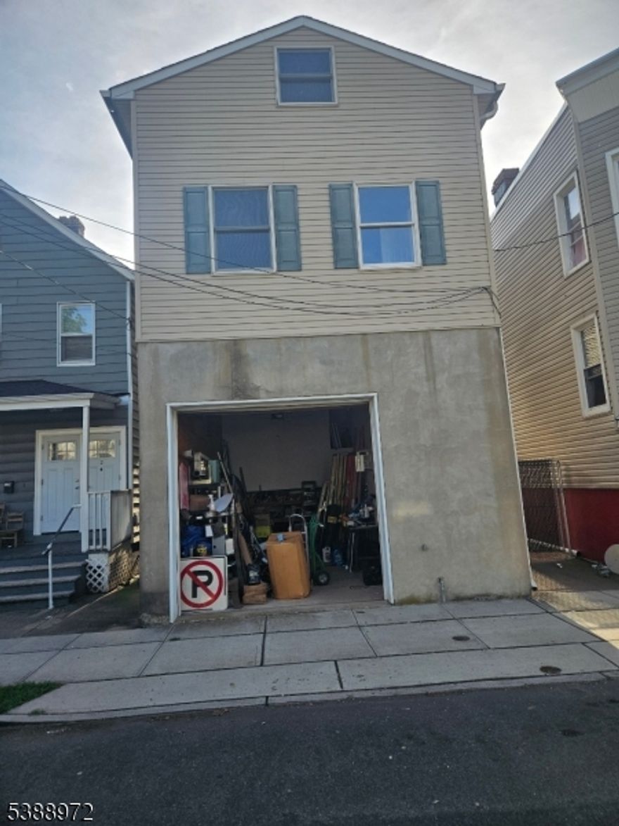 4A Commercial / mixed use building. 2nd floor is a 3-bedroom apt, ceiling fans, dishwasher, central air, laundry hookups, granite counter tops. 1st floor rear - Studio/ loft apartment, 14 ft ceilings, loft sleeping area, ceiling fans. 1st floor front - Garage 18 x 25 14 ft ceilings. 4A allows for a store front with many options. Currently used as an electrician's shop, with a half bath