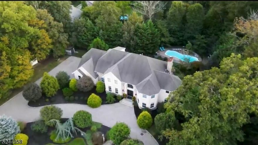 Indulge in the epitome of luxury living with this exquisite custom-built home, updated in 2023 and ready to impress.  Located on a dead-end street off a cul-de-sac, this property offers unrivaled privacy and serenity.  Spanning FOUR impressive floors of meticulously designed living space, this residence boasts a remarkable layout.  With five spacious bedrooms, five full bathrooms & a half bath, each member of the household will relish in their own private oasis.  The main level is a haven for entertaining, featuring a state-of-the-art remodeled kitchen and a harmonious flow through the well-appointed rooms.  As you venture downstairs, this space encompasses a movie theatre w/6 new electric recliners, a gym, media room, additional bathroom and a professsionally equipped basement kitchen.  The upper level accommodates four spacious bedrooms, three of which have their own ensuite bathroom, two of which have private offices.  The master suite stands out with a recently updated marbled spa-like bathroom and a design that perfectly combines sophistication and relaxation.  Step outside to a private oasis, complete with a sparking heated pool professionally landscaped grounds and a paver-circular driveway.  With the property spanning nearly 300 feet wide and positioned as the only home on one side of the street, ultimate privacy is ensured.  This home offers timeless elegance, unparalleled craftsmanship & exceptional attention to detail. Original owner.