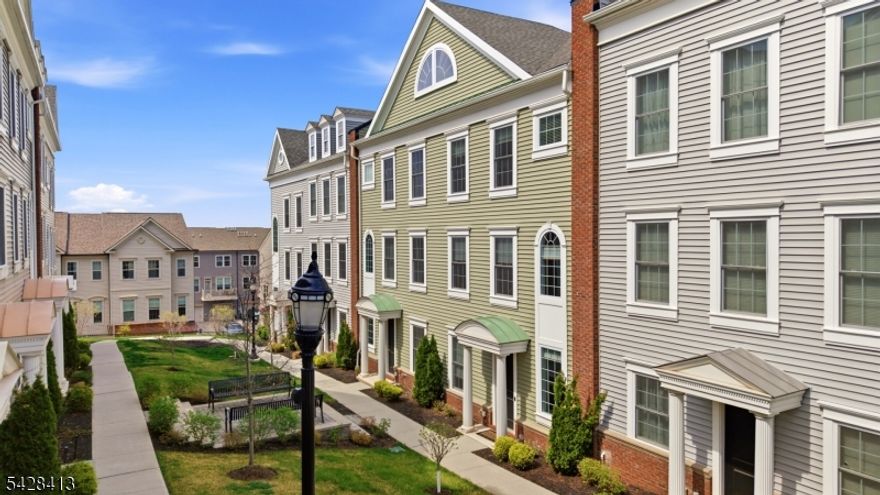 STUNNING Colonial Style Luxury townhome located in FINEST & sought after Wright Place Community of Wood Ridge;ONLY 4 YEARS OLD has so much to offer;beautifully kept,tons of upgrades,has TAX ABATEMENT left! 30 mins from Manhattan,close to major turnpike/freeways,offers ease of commute to NYC,Hoboken,Jersey City,Secaucus;Wood Ridge has train station at Just 5 MINS stroll,also offers option of 2 buses going directly into Manhattan that runs every 10-15 mins.Beautifully manicured green lush lawn, colorfully arched flower walkway welcomes you in.This home includes;front & rear entrance w/2car garage, 2 car driveway.1st floor has 9ft high ceilings,tall windows,2 closets,good sized 4th bedroom with a closet & full bath.Dramatically arched staircase will brings you to 2nd floor;open concept layout perfect for entertaining,10ft high ceilings,tall windows,massive dining space,modern Kitchen w/breakfast bar & Pantry, SS appliances,Quartz countertops, large living room w/outdoor deck offering.3rd floor offers primary bed suite w/full bath,his&her closets,2 add'l bedrooms,full bath & laundry room;2 Zone heating/cooling,hardwood floors throughout.Wood-Ridge has so much to offer;good schools,restaurants,coffee shop,liquor shop,pet grooming,phenix salon,sports field,parks & just steps away from TOP RATED Catherine Doyle elementary schools.The community provides gorgeous well-maintained green courtyards throughout.A perfect home for buyers & a great investment option with high;rent potential.