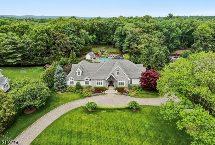 Something amazing happens when high quality construction and design are in harmony. It hits the perfect balance. Suddenly, the spaces inside have attitude...a voice. As you enter this exceptional estate, breathtaking architectural details blend to perfection with an open concept flow and modern-day spaces, fixtures, and detail. Find a huge light filled great room opening to a designer kitchen with 2 huge islands and the highest end appliances including a custom La Cornue range. Over the last 2 years, this house has undergone a complete $1.1MM renovation creating a unique bonus flex space, adaptable rooms, a spectacular Lower Level speak easy lounge/pub(with wet bar), music room plus media, gym, full bath. There is so much more...a LUXE Primary Suite (with a WOW! Walk-In-Closet that must be seen), 2 additional bedrooms and office on the main level. NEW 2000 sf 2nd floor guest suite with 2 bedrooms, family room, kitchenette, and spa bath! Sitting on 1.5 pristine acres of perfection! One of Franklin Lakes premier locations!