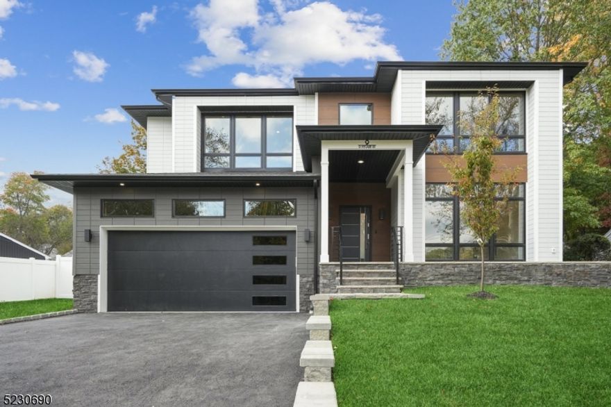 Brand New Construction by NJGCBCORP, a leader in Modern Architecture and Design.  Sleek, Modern and Contemporary Finishes throughout this Custom Smart Home with over 4600 sq ft of livable finished space.   An Impressive Home with Floor to Ceiling Oversized Windows, Modern Staircase and Open Concept Living.  First Floor w/10ft Ceilings, Formal Living Rm, Dining Rm w/Butler's Pantry, Large Family Room w/Gas FP and Sliders leading to Covered Patio.   A beautifully appointed Chef's kitchen w/ High End SS Appliances, Walk-in Pantry, Custom Cabinetry, Center Island w/Quartz Waterfall and Sliders leading to Stone Patio.  First Floor Guest Suite with Bedroom and Full Bath w/Heated Floors.   Mudroom & Powder Room complete first floor.  Grand Primary Suite w/ Vaulted Ceilings, Magnificent Windows, Custom WIC's and Sliders leading to Sun Deck.  Primary Spa Bath w/soaking tub, Dual Vanity and Heated Floors.  Three additional large bedrooms, two full baths and Laundry Room complete 2nd Floor.  Finished Walk-out Basement with 6th Bedroom, Full Bath, Media Room w/ soundproofing & speakers, Rec Room & Home Office/Gym complete basement level.  Landscaping package includes Sod, Irrigation System, Paver Patio, Trees and Fence.