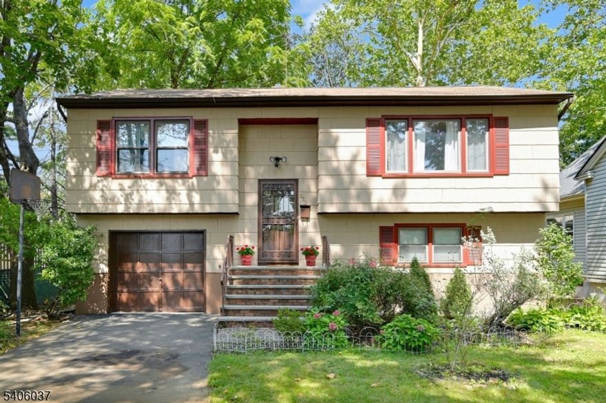 This move-in-ready expanded bi-level home offers 4 bedrooms, 2.5 baths, and approximately 2,646 sq ft of living space, ideally located in a high-demand Blue Ribbon school district. From the moment you enter, you're welcomed into the living area by a warm, inviting layout filled with natural light. Recent updates include a newer furnace and A/C (2022), Wi-Fi"enabled refrigerator (2022), dishwasher (2023), and exterior freshly painted in 2022. The main level features a spacious living room, formal dining area, and a kitchen with newer stainless-steel appliances. The primary bedroom features a cathedral ceiling, skylight, four full-size windows, recessed lighting, and ample closet space. The primary bath includes a jacuzzi tub, stall shower, and recessed lighting. Two additional bedrooms and an updated full bath complete this level. The lower level offers a family room with a fireplace and large open recreation area. A fourth bedroom, half bath, heated mudroom, and laundry room provide flexible living space. Enjoy outdoor living on the newly painted deck overlooking a large backyard, perfect for entertaining and gatherings. Additional features include a 1-car attached garage. Conveniently located near top-rated schools, shopping, restaurants, parks, major highways, and NYC transportation. A wonderful opportunity to own a move-in-ready home offering comfort, space, and convenience.