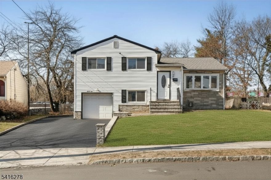 Beautifully renovated 5-Bedroom Split-Level home in the heart of Hillside, Union County. This spacious home offers a versatile layout and modern upgrades throughout. The main level features a bright living room with cathedral ceilings, dining area, and an updated kitchen complete with quartz countertops and stainless steel appliances. The second level includes three spacious bedrooms, a full bathroom, and a large linen closet. On the lower level, you'll find two additional bedrooms, a full bathroom, direct access to the garage, and an inviting three-season enclosed porch that leads to the backyard perfect for relaxing or entertaining. The finished basement provides even more living space with a flexible office or playroom area and a dedicated laundry room. Ideally located between Route 22, I-78, and the Garden State Parkway, this home offers excellent commuter access to Newark Airport, Jersey City, and New York City.