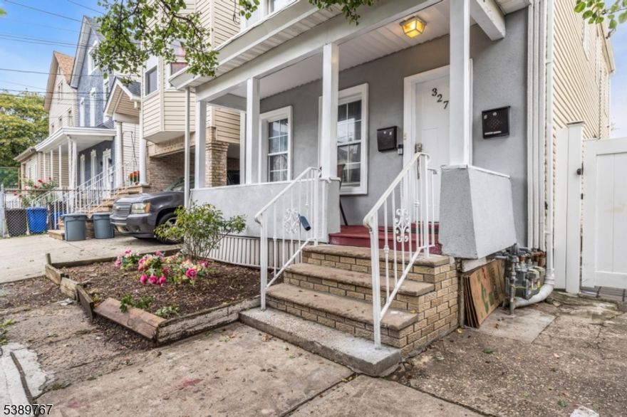 Welcome to this spacious two-family home, ideal for rental income. Each unit includes 3 bedrooms, 1 full bathroom, living room, and eat-in kitchen, featuring a partially finished basement with versatile space for storage, recreation, or potential expansion. Private fenced backyard paved with brick and additional shed for storage. Conveniently located near shopping, public transit, Newark Airport, and New York City great investment opportunity.