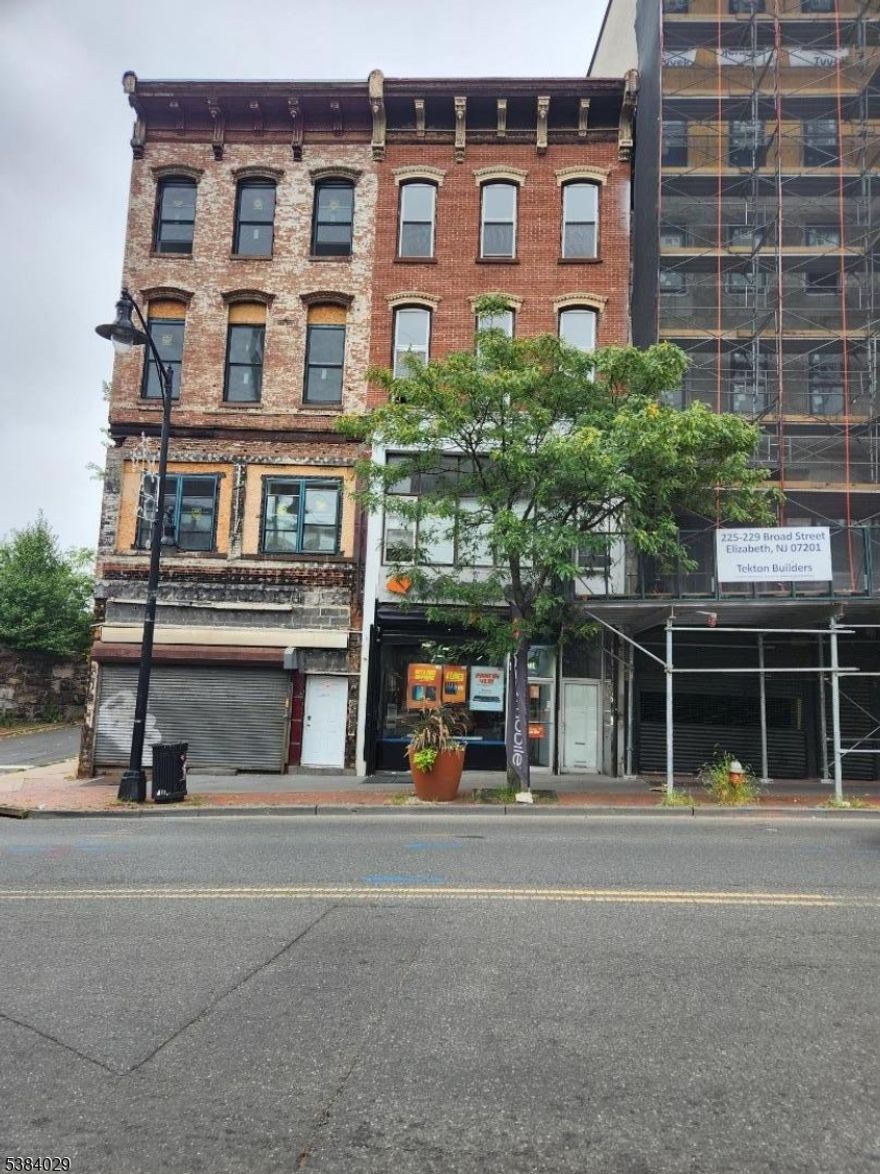 Prime mixed-use property featuring two buildings front building 4 stories, rear building 3 stories ideally located across from NJ Transit train station with a NYC bus stop at the doorstep and minutes from major highways. Includes freight elevator, two AC units, and municipal parking lot in the rear. The 1st-floor retail unit is leased at $2,600/month, and the rear building is used as a driving school at $2,200/month; other units are vacant. The roof is 3 years old, plumbing is all PEX, the electric system was updated in 2015, and the gas heat is 10 years old. Ideal for professional, commercial, retail, storage, and many other uses.