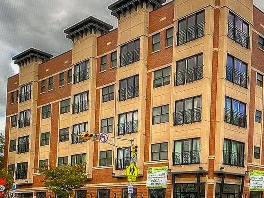 This condo name is Harmony Square. It's built in 2013 and is centrally located in the Mt. Pleasant section of Newark! Lovely modern/contemporary 1 bedroom, 1 bathroom condo is in a prime heart of the city location.  Beautiful hallways lead to this peaceful and modern unit. So much shopping with entertainment and transportation mins away from Newark Penn Station and Newark Airport. Open floor plan with generous living room and large windows to allow natural light. Contemporary kitchen w stainless steel appliances, granite countertops, and lots of cabinet space. Elevators, in-unit laundry facilities, an underground garage although this unit does NOT have a designated space, a secure entry system and 24-hour surveillance. With so much to do in Newark you won't want to miss this beauty.