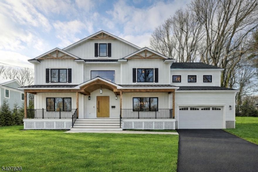 Spectacular construction in the highly desirable Dogwood section of Scotch Plains offering  5342 sq ft above grade and approx 7300  sq ft including the finished basement. This home features 9' ceilings on the first and second floors and the basement too, hardwood flooring throughout, formal living and dining rooms, and 12x12 foyer. The gourmet kitchen with an oversized island seating 5+, built-in microwave, premium appliances, gas range with lift-up touchscreen controls, pot filler, and a hidden walk-in pantry with direct access from the garage. Refrigerator includes self-filling purified water pitcher & ice maker. First floor includes private office, separate bedroom with full bath, powder room, family room with gas fireplace and Beamed ceilings, and oversized high-security sliding doors opening nearly two-thirds to the backyard, filling the home with natural sun light. Mudroom off garage with coat station &storage. Second floor offers 5 generous bedrooms. Luxurious primary suite features cathedral ceilings, walk-in closet with custom built-ins and center island, and spa bath with heated floors, soaking tub, double sinks,& large walk-in shower w/bench. Second floor laundry. Finished basement with 9' ceilings includes rec room with kitchenette and wine refrigerator, gym, play/learning area, full bath, and bedroom with egress window. Walk-up unfinished attic offers future expansion. Hardi plank exterior, covered front porch. -
