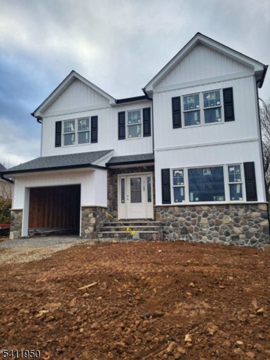 New Construction with real stone front & limestone steps & inlay...4 bedrooms, 2 full 1 half baths...3,100sq.ft...approximately 2,300 sq ft. above grade, 900 sq. ft below grade... full finished basement for you to convert into office, playroom or storage....9' ceilings on all 3 levels....upgraded trim package with crown molding in living rm, dining rm and family room w/6panel solid doors, all openings & windows are trimmed...upgraded lighting over 60 Halo lights throughout house...wood burning fireplace in family room...kitchen with 42" upper cabinets w/quartz backsplash and countertops...stainless steel stove, microwave and dishwasher...Kohler fixtures throughout house...2 zone heat and air conditioning, tankless hot water heater...Hickory hard wood plank floors throughout 1st & 2nd floors...basement has waterproof luxury vinyl plank flooring...easy access to NJ transit & major highways. Train station less than 1 mile away, 287 & 78, 10-15 minutes away...New Home Warranty - Backed by the DCA-State of NJ and paid for by the Builder