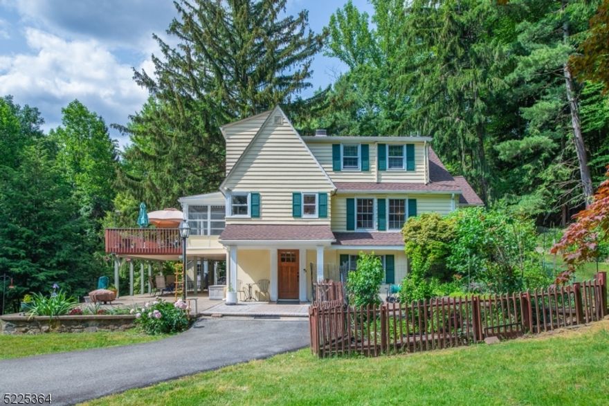 A very unique opportunity! Charming, well maintained spacious home with historical character, in a one of a kind 1.28 acre secluded, park like setting property with a babbling brook! A nature lover's dream! A must see property! The home features 3 levels of living. The ground level features a foyer, great room with wood burning fireplace, bedroom/office, full bath, laundry room, utility room & storage. And walkout to covered patio. The second floor has a sunny kitchen, living room with wood burning fireplace, dining room, primary suite with full bath, screened in porch and composite deck. The third floor has a spacious family room, two large bedrooms and a full bath. Great opportunity to entertain with the large wrap-around patio and deck, overlooking the beautiful property and brook. There is also an oversized detached garage and workshop, ideal for a home business or hobby. The property is serviced by public sewer and water, and natural gas. Award winning Randolph Schools. Close to highways and public transportation. Eligible to purchase Shongum Lake Rights and enjoy all that Shongum Lake has to offer. Home is not visible from the street, and there is no sign on the property.