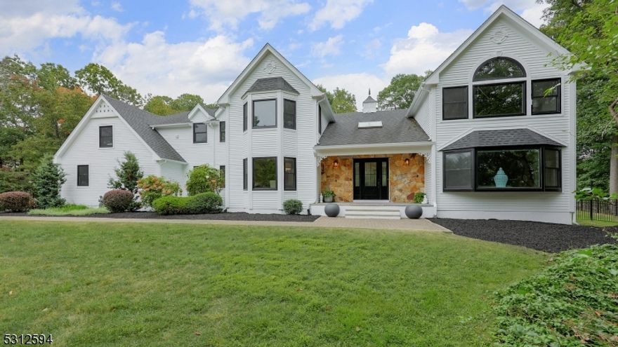 Exquisite custom Colonial home located on a quiet cul de sac street, nestled in the hills of the Watchung Mountains.  A 2 story, bright and airy foyer provides a warm and elegant welcome, thanks to an impressive curved staircase, and artisan wood trim details.  The gem of the main living space is the majestic family room, highlighted by vaulted ceilings with wood beams, a stately stone wood burning fireplace, and a wet bar.  A newly renovated gourmet kitchen offers stainless steel appliances, a large prep island, eat in kitchen space, and access to the outdoor oasis.  The 1st floor bedroom and full bath are an ideal guest suite or work from home space.  Dual staircases lead to the upper level, which boasts a primary suite offering a newly renovated en suite bathroom, vaulted ceilings with wood beam accents, a walk in closet, and loads of windows to allow natural light to flood the space.  An upper level laundry room adds ease to the chore.  The fully finished lower level features a half bath, sauna, and space for recreation, hobbies, a gym, or theater.  Unwind with the ultimate staycation, in the fully fenced in backyard retreat, complete with an inground, heated, salt water pool and hot tub, expansive patio space, oversized outdoor grill, and mature landscaping for privacy.  Located in an excellent school district, and close to highways 78/22/202/206.