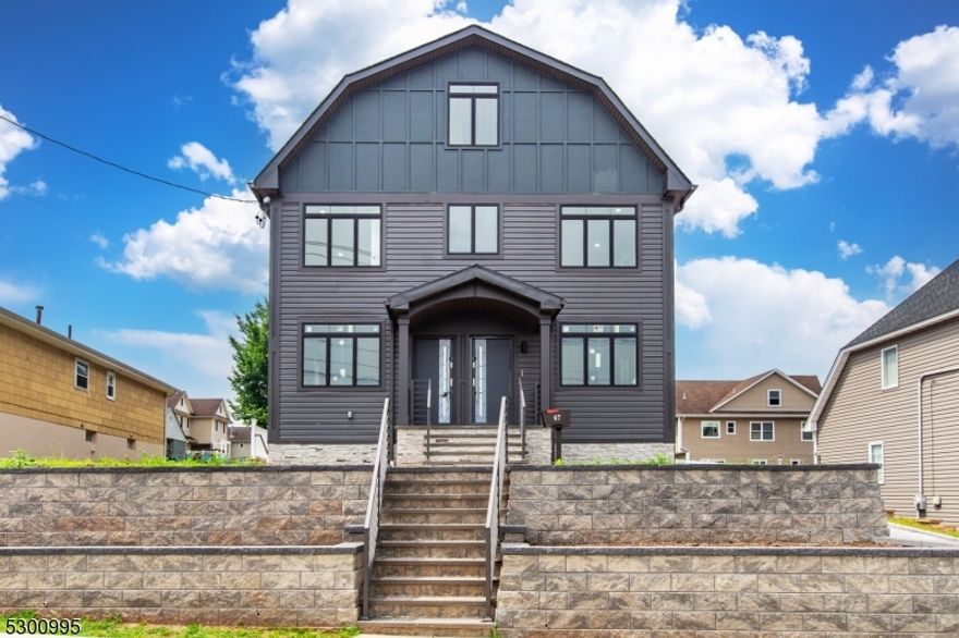 Prime Location! This newer construction (2024) second-floor unit offers 3 spacious bedrooms and 2 full baths. The open-concept living and dining area flows seamlessly into a modern kitchen with stainless-steel appliances, a center island, and ample cabinet space. The primary suite features a generous walk-in closet, while a versatile bonus room can serve as a pantry, storage, or home office. Added convenience with two dedicated parking spots. Perfectly situated near shopping, dining, and just a 5-minute walk to the NYC bus stop on Franklin Ave. Don't miss this opportunity, won't last!