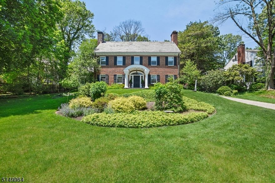 Classic 1931 Colonial in a prime Summit neighborhood, within close proximity to town and transportation.  Front to back foyer has views to the rear courtyard. Many updates and renovations inside and out including bluestone patio and courtyard with gas fire pit, knee walls, retaining walls, landscaping and driveway. New custom kitchen with Blue Star range, oven and hood, Sub Zero refrigerator, separate refrigerator and freezer drawers, and more. Great room with vaulted ceilings and doors out to courtyard. 5 Bedrooms and 4 1/2 baths, 2 of which recently renovated. New windows on first floor. Refinished floors throughout. Extensive millwork recently added including coffered ceilings and wainscoting. First floor sunroom/office with 3 walls of windows and door out to the private yard and terrace is the perfect spot for working from home. Wonderful flow for entertaining and everyday living.