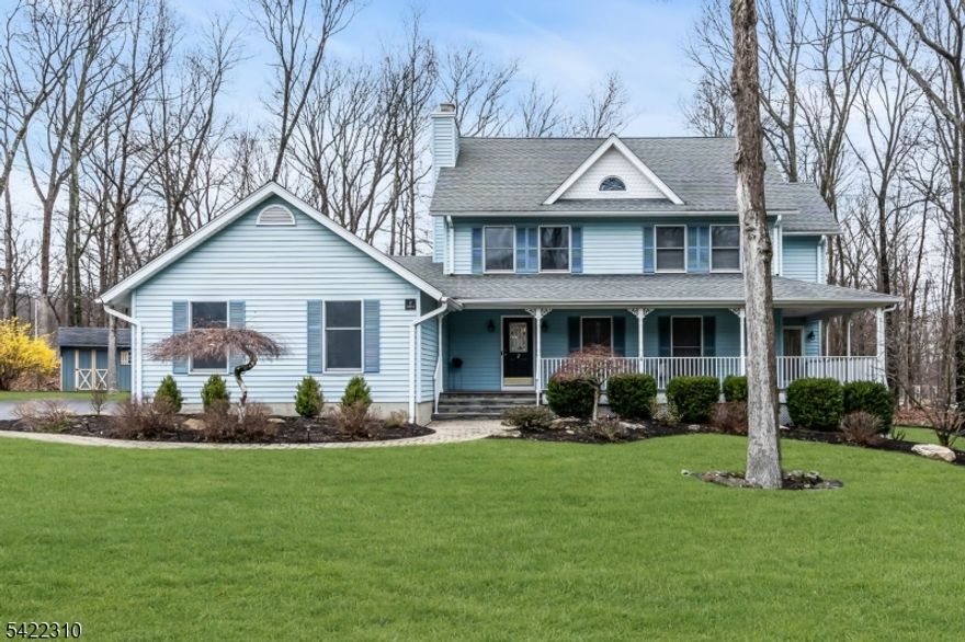 Warm and inviting Farmhouse Colonial set in a desirable walk-around neighborhood, beautifully positioned on a level, professionally landscaped 1 acre lot. Enjoy outdoor living with a wrap-around covered porch perfect for casual gatherings, plus a sun-filled backyard featuring a deck and patio for dining, an above-ground pool, and a storage shed. A welcoming foyer opens to a spacious living room flowing into the dining room, both accented by oak hardwood flooring. The light and bright kitchen with stainless steel appliances opens seamlessly to the breakfast room and family room with hardwood floors, a cozy fireplace, and French sliders leading to the rear deck. A convenient side entry foyer offers garage access and connects to the laundry room and powder room.  The second level features four bedrooms with new neutral carpeting and a full guest bath. The primary suite offers a walk-in closet and a private full bath. A third-floor walk-up is framed for future living space or abundant storage. The partially finished walk-out basement includes a bonus room ideal for a home office or game room, plus a workshop and utility area. Ideally located near shopping, parks, and recreation, with easy access to NJ Transit and major routes, making this home a true commuter's delight. Spacious, charming, and perfectly suited for today's lifestyle. Notables: Natural gas in the street. 3150 total square footage on the floor plan. Survey, seller disclosure and upgrade details for review.