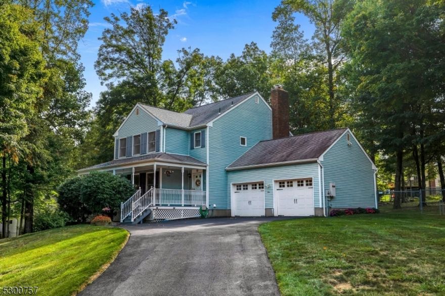 This house just feels like home! A covered front porch greets you and leads to a welcoming entry with hardwood flooring, living room with built-ins, formal dining room, warm family room with wood burning fireplace, kitchen with pantry and access to deck overlooking fenced private backyard. The second level offers 3 spacious bedrooms, main bathroom plus primary bedroom with full bath and 2 double closets. The unfinished basement has limitless possibilities. Other features include 2 car garage with openers, 2 zone natural gas baseboard hot water heating, central air cooling, built-in Generac generator, thermalpane windows, fully fenced rear yard, newer water heater in 2024, top rated Mt. Olive schools and easy access to Rts. 80 and 46.