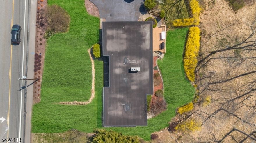 Incredible opportunity, true ranch living with winter reservoir water views Welcome Home! Features include: a one-floor lifestyle, inviting foyer, an open floor plan with a formal living room and dining room, a beautiful fireplace, and an impressive wall of windows overlooking private property and winter reservoir views. Large kitchen with a sun-filled breakfast room. Primary suite: large closets and a full bathroom. 2 nicely sized bedrooms and a full bathroom. Option for 4th bedroom: Separate bedroom with a full bathroom and private entrance. Perfect for a guest room, family room, playroom, office, or potential in-law suite. Wonderful three-season room with a hot tub leading to a large deck and private property with a secluded yard area. Property attributes: Laundry Room, Tons of natural light, hardwood floors, ample storage, brick exterior, very well maintained by owner, one car garage, brand new septic system (4/2026), Great location: top rated school system, minutes to major highways, community activities, Trader Joe's, Whole Foods, town library, and NJ Transit Bus and Train center.