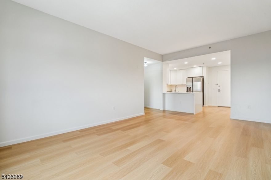 Experience upscale high-rise living in this spacious and fully renovated two-bedroom, two-bath residence at Skyview. This expansive unit offers a thoughtful layout with generous room sizes, abundant natural light, and beautiful New York City views perfectly blending comfort and style.The renovated kitchen features sleek quartz countertops, stainless steel appliances, and contemporary cabinetry, seamlessly flowing into the open living and dining area ideal for both everyday living and entertaining. The convenience of an in-unit washer and dryer adds ease to your daily routine.Both bedrooms are well-proportioned, with ample closet space and the benefit of two full, updated bathrooms designed with clean, modern finishes. Every detail has been curated to offer a refined, move-in-ready living experience.Skyview offers an impressive suite of amenities, including a rooftop with panoramic views, a bar-style restaurant, residents' lounge, and a fully equipped fitness center, along with garage parking for added convenience.Located in the heart of downtown Rahway, this home places you moments from shopping, dining, and entertainment, with the train station directly across the street for a seamless NYC commute via express service. A doggy daycare next door adds extra appeal for pet lovers.Luxury, space, and skyline views come together in this exceptional Skyview residence schedule your private showing today.