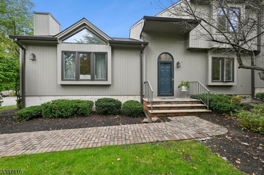 Don't miss this Rare Opportunity! Impeccably maintained, freshly painted, move-in-ready luxury end-unit townhome - the largest model in the Spruce Edge community! Experience a main level filled with natural light, featuring soaring vaulted ceilings, updated windows, skylights, and beautiful hardwood floors. The updated eat-in kitchen offers new cabinets, a new range/oven/microwave, and elegant LED lighting. The main level offers multiple gathering spaces: a formal dining room, a living room with a fireplace, a family room with a charming stone fireplace, and a sun-drenched den with sliders opening to a private deck overlooking a serene pond. Upstairs, the primary suite is a true sanctuary with an updated en-suite bathroom and two spacious walk-in closets. The two additional bedrooms each feature their own walk-in closet. The attached 2-car garage features an epoxy floor and a high-voltage plug, perfect for EV charging.  A versatile finished basement includes a recreation room, laundry facilities, a cedar closet, and stylish tile flooring. Set on beautiful, park-like grounds, this prime location offers lake and beach privileges. Don't miss the opportunity to own this perfect blend of luxury and convenience.