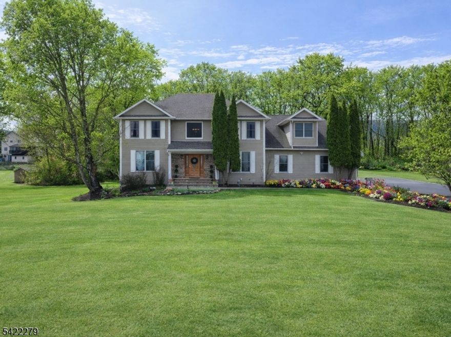 Welcome to one of the most desirable neighborhoods in Vernon Township, High Ridge Estates. Homes rarely hit the market in this pristine community. This beautiful center hall colonial offers 5 bedrooms and 3.5 bathrooms, featuring beautiful hardwood floors, soaring cathedral ceilings, cozy wood-burning fireplace and so much more. The open layout flows seamlessly into a spacious kitchen with high quality cabinetry and an inviting dining room. Perfect for hosting holidays and gatherings. Next to the eat in kitchen area you will find a generous sized living room with cathedral ceilings and a convenient half bath located nearby. A standout feature of this home is the bonus room off the garage with a full bath and separate entrance, ideal for guest suite, or flexible living space. Step outside to an open deck overlooking a flat, usable yard, perfect for summer entertaining, BBQs, and everyday enjoyment. Upstairs, you'll find four generously sized bedrooms, including a bright and inviting primary suite with a private bath, soaking tub, and oversized walk-in closet. The walkout basement is unfinished, offering ample storage and endless potential to customize and expand your living space. This home is conveniently located near Route 23, making it ideal for commuters. Enjoy easy access to Mountain Creek Ski Resort and Waterpark, Crystal Springs, and the wineries and charming shops of Warwick.