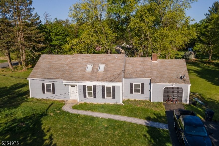 Wow talk about location!! *4 bedroom* *2 full bathroom* large cape on *1 acre* of property. This is the epitome of easy access to major routes such as route 173 and interstate route 78. The house has a great flow entering in through the front door to the living room which flows easily to the long modern eat-in kitchen and then looking forward to some relaxation in the family room complete w/ a wood fireplace. There are also 2 bedrooms on the first floor which can easily also function as an office or hobby room. Upstairs you will find the primary bedroom with two closets, another bedroom, full bathroom, and an additional large sized room that has many functions as an office, huge walk-in closet, or even just storage. Lots of different options! The property also has a  *Newer gas furnace and central air*. The well pump is under 7 years old. *Granite countertops w/ newer backsplash and new appliances such as the dishwasher and oven/stove.*