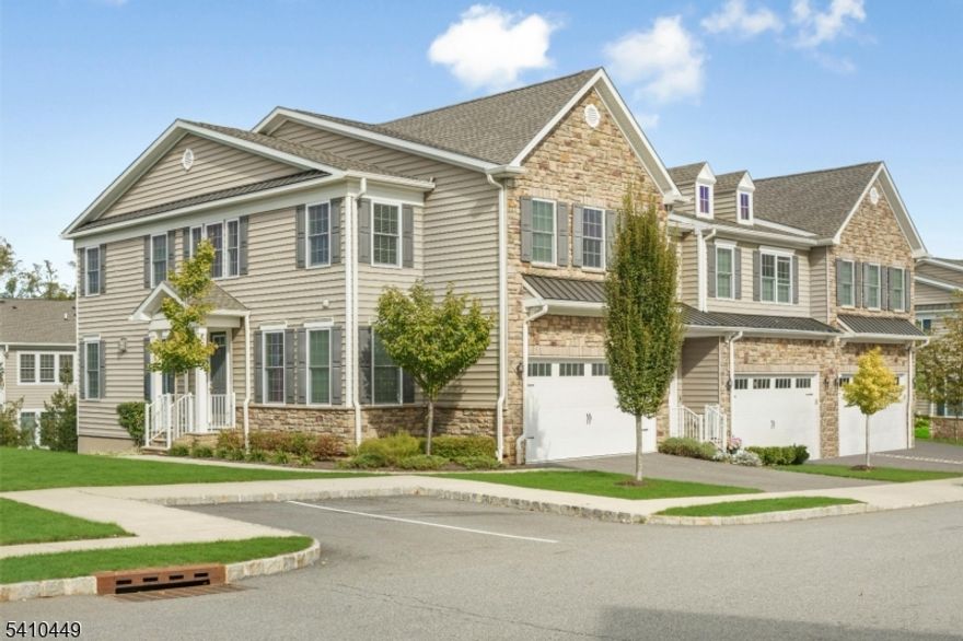 Discover refined townhome living in this exceptionally bright and airy Claremont end unit, one of the most desirable models at The Residences at Columbia Park. Perfectly positioned just minutes from downtown Madison, Morristown and major highways, this residence offers an ideal balance of luxury and convenience. Sunlight streams through oversized windows, enhancing the open concept layout and highlighting the generous proportions of each living space. The main level is designed for both everyday comfort and effortless entertaining, with seamless flow between the living room, dining room and gourmet kitchen where rich cabinetry, expansive quartz counters and premium appliances create a space that is as functional as it is sophisticated. Upstairs, the primary suite offers a serene retreat complete with a spacious bath and abundant closet space. Two additional bedrooms and a versatile loft provide flexibility for guests, work from home needs or additional lounge space. The finished lower level includes a large recreation room and full bath, ideal for lounging or entertaining, while a private deck with peaceful views offers the perfect setting for morning coffee or evening relaxation. Residents enjoy access to resort style amenities including a stunning clubhouse, sparkling pool and manicured grounds that enhance daily living. Spacious and thoughtfully designed, this exceptional end unit sets the bar for modern comfort at its very best.