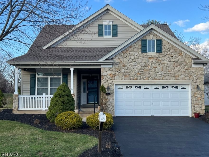 Beautifully maintained, move-in ready Dickinson Model in Flemington's highly desirable Walnut Brook 55+ adult community is not to be missed. This spacious home offers added privacy and abundant natural light. Charming front porch, ideal for rocking chairs and outdoor relaxation. Welcoming Foyer, spacious 1st floor primary bedroom with hardwood floors, tray ceiling, oversized closet with built in closet organizers and a recently renovated en-suite with dual vanities, water closet, and large tiled marble shower with built in seat. Carpeted guest bedroom located on the 1st floor, and a carpeted loft/den/office located on the 2nd floor. The kitchen includes stainless steel appliances, granite countertops, tiled backsplash, pantry, a breakfast bar, and a breakfast nook. The dining room features crown molding and chair railing. The inviting living room featuring a corner gas fire place, tray ceiling and recessed lighting. The screened-in back porch with newly installed Trex flooring is perfect for three-season enjoyment with a privacy backdrop of mature evergreen trees. Laundry room with vanity, with many upgrades including both bathrooms, new Roof (2025) and Windows (2020), new hot water heater March (2026) Two-car attached garage with electronic opener, and foyer entry. washer/dryer/refrigerator are included in as is condition