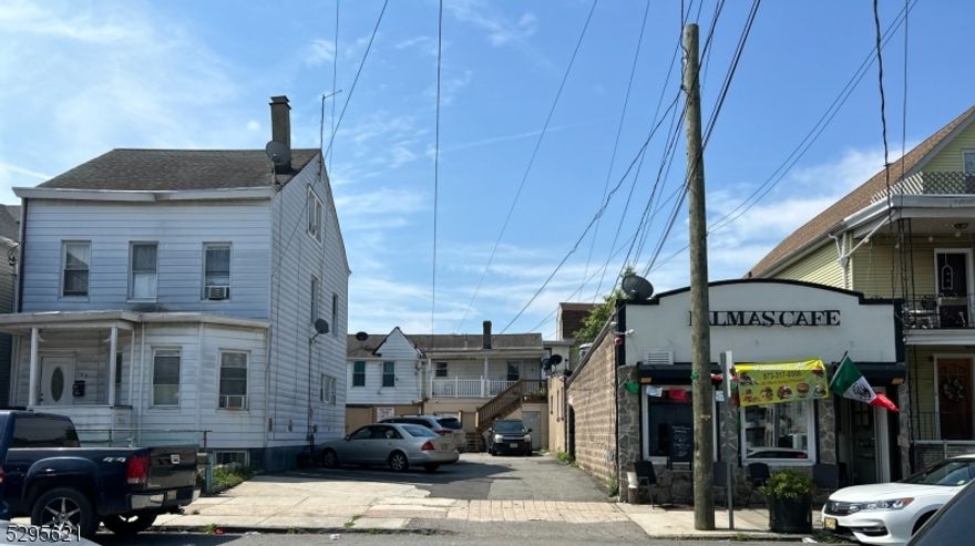 The property has a great rent roll for any investor. The CAPE RATE is above 8-9%. The one-family house rented for $2,685. The rear apt is rented for $2,400.00, and the restaurant rent is $2,200.00; the Garage rent is $825.00.  Studio apt rent is $1,100.00. The other rear unit is $2,100.00. The listing is being sold as a 4-unit property with the restaurant and garages with the addresses of 100, 102, and 104 3 Ave, Paterson. The total monthly rent is $11,310.00, with the tenants paying their heat and AC expenses. So the property has one fam, store/restaurant, rear apt 2nd fl, garage storage, Studio apt, Rear apt. The yard has room to park up to 4-5 cars. The total annual rent is $135,720.00; the total taxes for the property are $33,854.00