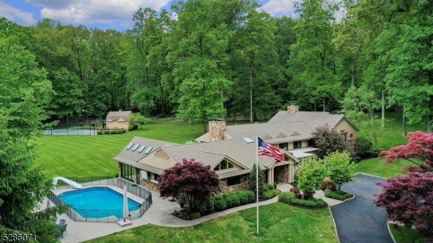 Welcome to your private oasis! Nestled on nearly 8 acres, this remarkable home offers unparalleled luxury with an additional one bedroom home on property.The main house features 5 spacious bedrooms and a sun-drenched open floor plan for relaxation and entertaining. Indulge in culinary delights in the gourmet chef's kitchen with all essentials. The great room boasts vaulted ceilings and a floor-to-ceiling fieldstone fireplace, while the dining room offers indoor-outdoor living with retractable motorized screens and a butlers pantry/den with wet bar. Unwind in the nearby media/family room with a wood-burning fireplace and home bar. Find tranquility in the private office, spacious playroom, and exercise room. Retreat to the primary suite with a sitting room, double-sided gas fireplace, private patio, spa-like bath with jacuzzi and steam shower, and an oversized walk-in closet. Four additional bedrooms, 2 full baths, and a laundry room complete the second level. Outside, enjoy the in-ground pool, multi-sport game court, detached three-car garage, barn and second home featuring an open-plan; kitchen, spacious family room, full bathroom, bedroom, laundry and a private patio; ideal for guests. With a new septic system, top-of-the-line security system, sound system, Lutron lighting, built in home generator, farm assessed status and meticulous maintenance, move right in and start living your dream staycation. Convenient to Bernardsville, schools, and NJ Transit. A must see!