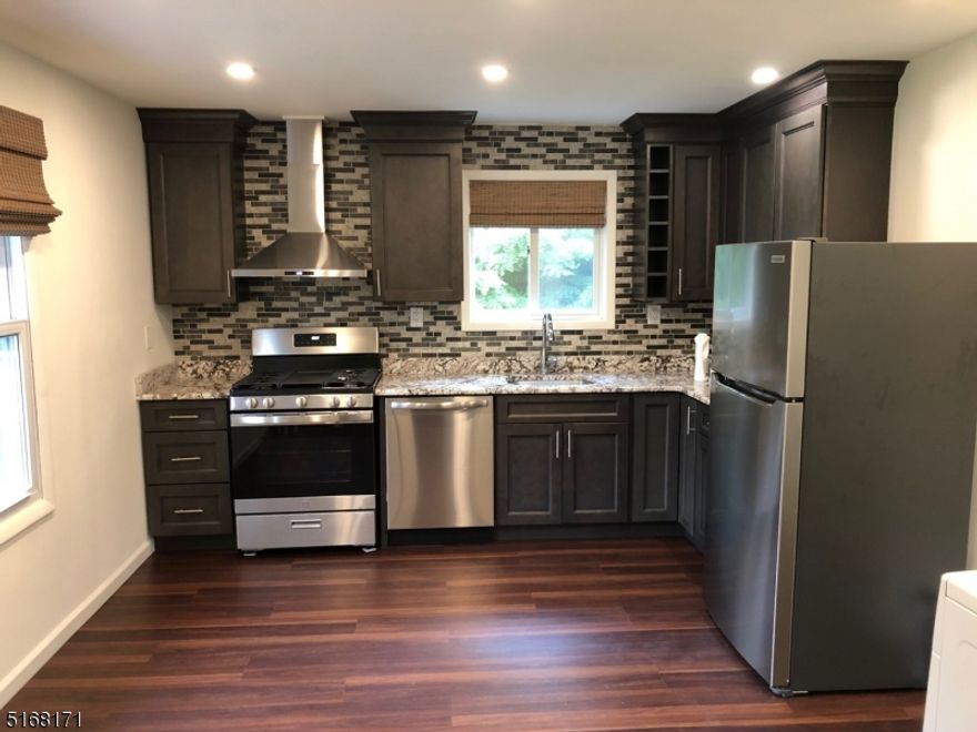 Gorgeous must see fully renovated one bedroom apartment.  Private entrance leads into a large foyer, fully renovated eat in kitchen with granite countertops, new cabinetry and stainless-steel appliances, a spacious bedroom offering a large walk-in closet, stackable washer and dryer in laundry room and air conditioning throughout.  Excellent location near the hospital and set back off main road with 3 dedicated off-street parking spots.  This stunning apartment is vacant and has immediate availability.