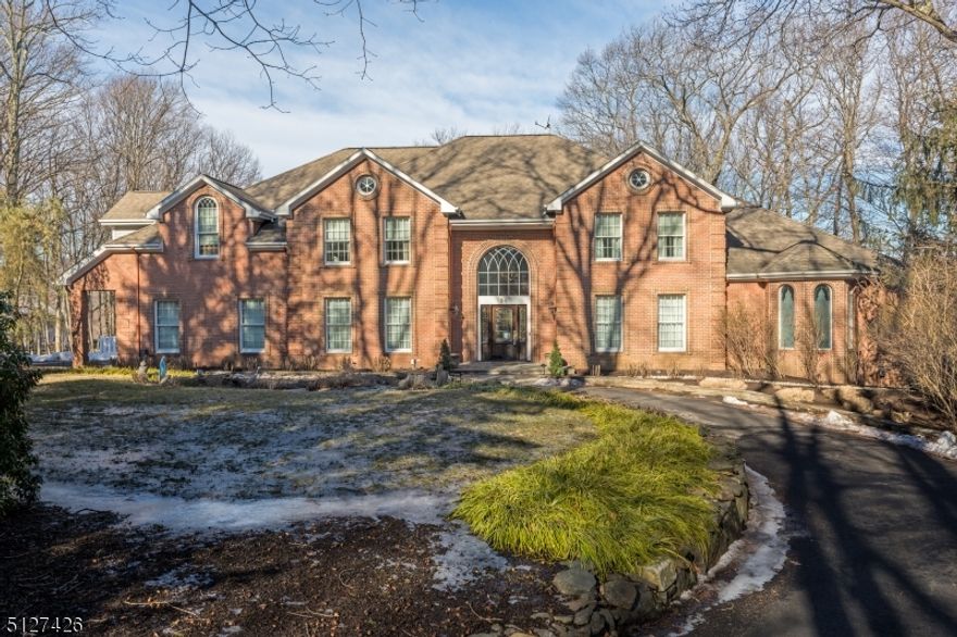 Elegance, luxury and style describe this custom home with 6915 sqft of living area situated on 2.83 wooded private acres in desirable Montville Twp. Light filled spacious rooms, gourmet kitchen with chefs oven-6 burners, double ovens and griddle , SS appliances, family room with 2 story vaulted custom wood ceiling with a library and game room with bar area off family room. Custom woodworking and one of a kind inlaid wood floors are through out this beautiful home.The first floor offers a master bedroom suite with sitting area and master bath, living room with coffered ceiling, dining room with custom wainscoating opens to a butler's pantry, gourmet kitchen, half bath , family room, game room, office, full bath, laundry and trex deck off kitchen. Second floor has 4 bedrooms, 3.1 baths which includes a in law suite with full kitchen, full bath, bedroom and dining/living area. LL is partially finished with family room , gym, office and walks out to stone patio and in ground natural look gunite pool. Many updates new paved circular driveway 2021, pool tiled 2021,new well pump, new A/C unit, updated baths and kitchen just too many to name. You won't be disappointed!