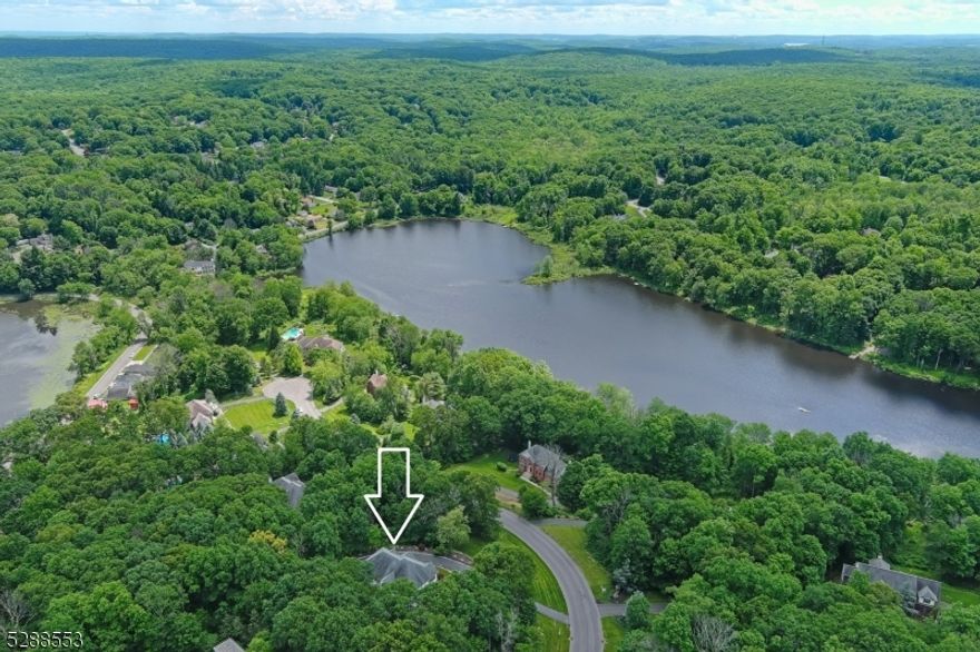 First time offered by original owner who made very tasteful and smart upgrades during build including several arched transom windows, a 2nd stair case to upper level, a bonus room off kitchen (plus Fam Room, Living Room, and home office also on the 1st floor), a gas fireplace in the Primary Suite, and HUGE SIDE PORCH.  Seller also states "room for pool in right rear yard".  Don't miss walk-in closets in BR 3 and 4 with Jack-N-Jill bath in between, En Suite Bath in BR 2, and exceptional views from most windows.