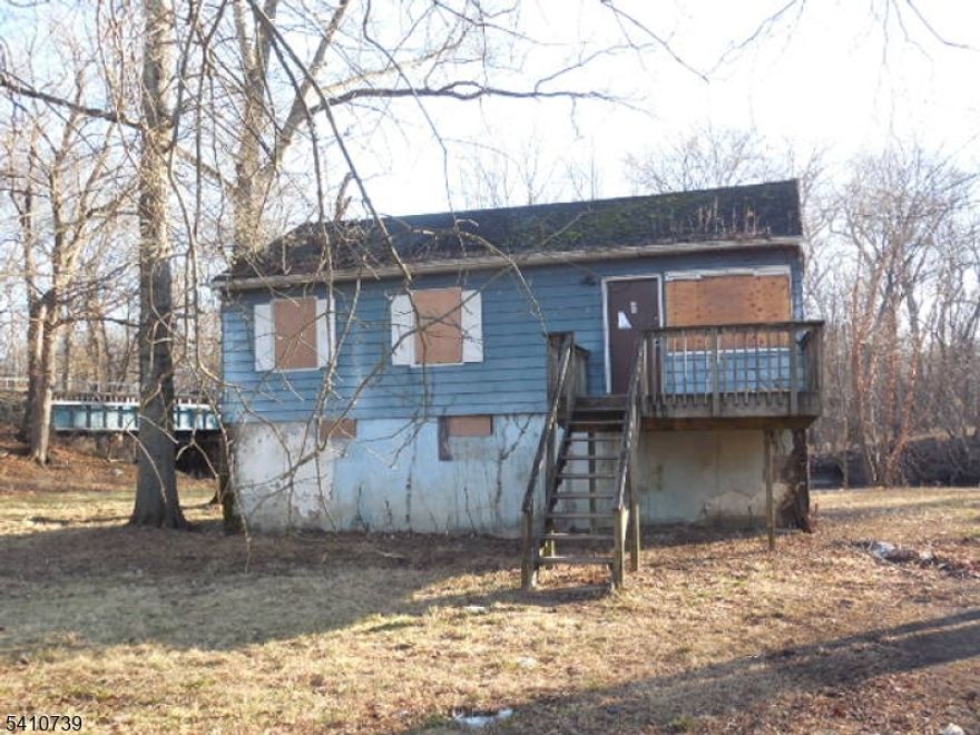 Raised Ranch in need of complete rehab inside & out. 2 Bedrooms 1 Full Bath on a quiet dead end street. Home has a septic system & well water as per the town. Property is being sold in absolute "as is" condition all town required inspections are responsibility of the purchaser as well as all final water & sewer bills. Due all due diligence with the Township of Wayne & DEP on the property before placing an offer. Please use caution when entering flooring is soft in some areas also wear a mask due to mold. Property will require flood insurance.