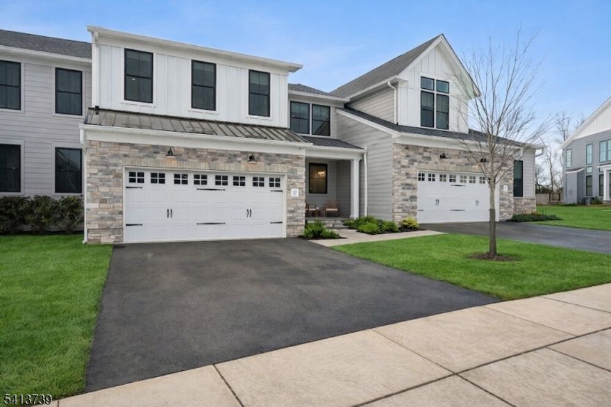 Welcome to elevated living at The Carriages at Berkeley - 3,377 SF where design meets luxury. This stunning 4 bed, 4.1 bath townhome offers refined finishes, generous space, and a layout designed for both entertaining and everyday living. Step inside to a breathtaking open-concept main level where soaring 2 story ceilings and walls of windows flood the home with natural light. The dining area, living room, and kitchen flow seamlessly together, creating a warm yet sophisticated space. At the heart of the home, the chef's kitchen is appointed with high-end SS appliances, quartz countertops, and an oversized center island.  The main-level primary suite is a true retreat, featuring 2 walk-in closets and an oversized spa-like bath designed for relaxation. Upstairs, you'll find 3 additional bedrooms including a 2nd primary suite   offering incredible flexibility.  A spacious family room overlooks the main level, enhancing the open feel and providing an additional space to unwind. The finished basement offers the perfect setting for a rec room, home office or gym, along with abundant storage. Enjoy summer evenings on the private deck just off the living room ideal for outdoor dining or quiet nights under the stars. With maintenance-free living, you'll have more time to enjoy everything this beautiful community has to offer. Complete with a 10-year home warranty, this bright and impeccably maintained home is truly move-in ready   what an opportunity to move in and feel right at home.