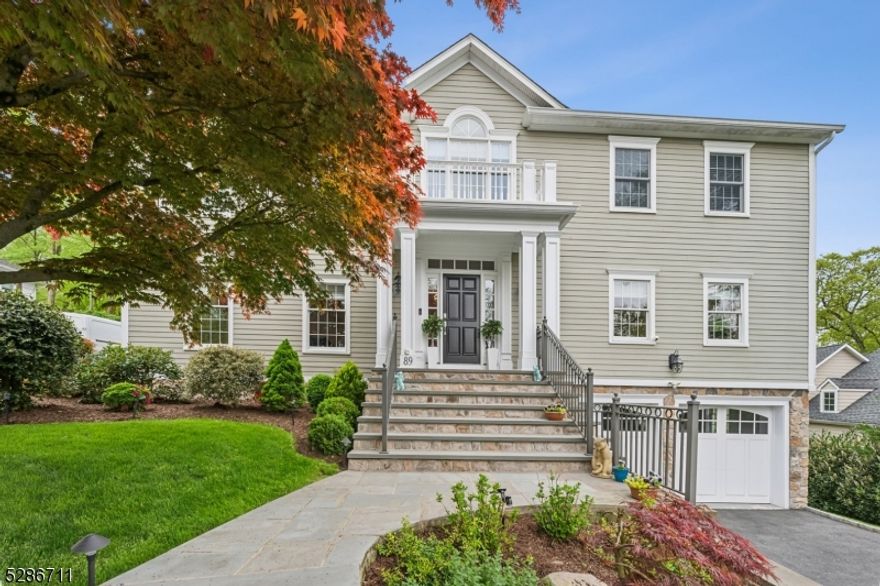 Quintessentially Short Hills (Poet Section) luxury custom colonial home fully remodelled and upgraded to an impeccably high standard nestled in a private yard with sweeping views of Canoe Brook Country Club golf course. Grand 12' ceilings in the family room, master bedroom, & breakfast area. A beautifully sun-filled remodelled eat-in kitchen, with high-end appliances carries itself to the family room with an expansive wall of windows and sliding glass doors leading out to a large deck and stunning views. Boasting 7 bedrooms (including in-law suite on first floor), 5 full baths, and 1 half bath this home has been meticulously updated throughout with all new major systems and an open concept first level made for entertaining. A 1st-floor in-law suite with an ensuite bathroom is perfect for guests or multi-generational living. Enjoy the convenience of an integrated oversized two-car garage, with connected mudroom and backyard access.  In a prime location for Top-Rated Millburn Schools and walking distance to Hartshorn Elementary, Gero Park and Short Hills Mall make this a wonderful place to live. Every fine detail of this house was made to be a forever home.