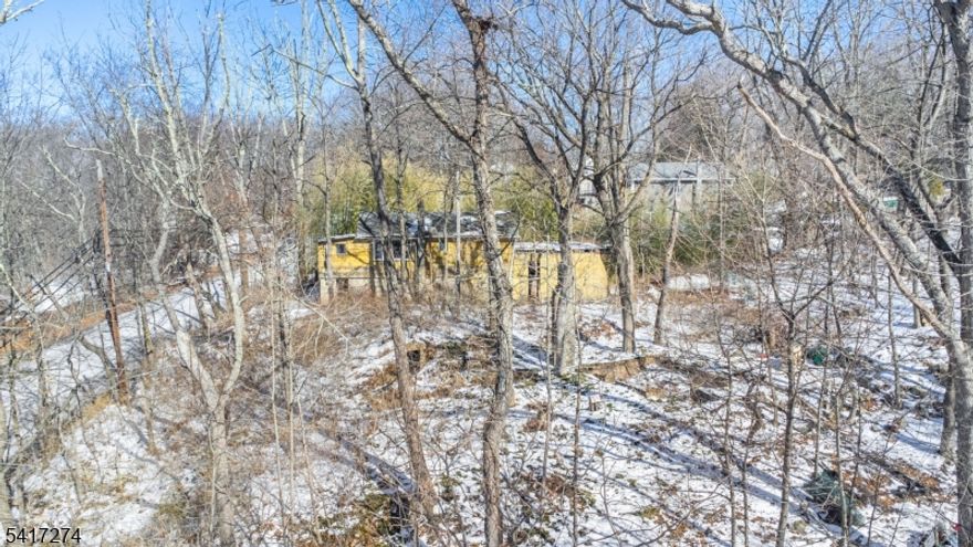 Perfect opportunity to renovate or build your dream home on this prime property! Approvals for a new septic system are already in place, and plans for a new  2 bedroom 2-1/2 bath with a den home are included-making this a truly shovel-ready project. ideally located just a short. walk to the lake, the property offers beautiful vioews and endless potential. Wheter you're looking to rehab, rebuild, or invest, this is an incredible opportunity that should not be missed.
