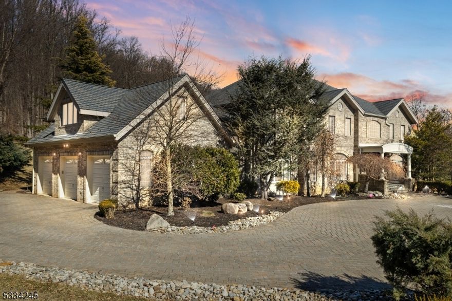 This stunning custom all-brick colonial sits on 2.87 acres in beautiful Martinsville, offering breathtaking mountain views. With 5,600 sq ft of luxurious living space, plus an additional 2,800 sq ft in the fully updated walkout basement, this 6-7 bedroom, 4.5-bath home is a masterpiece of design and craftsmanship. A grand two-story foyer welcomes you, featuring 10-ft ceilings on the first floor and 9-ft ceilings on the second. Gleaming Brazilian hardwood floors and imported tile complement the exquisite trim and detailed finishes throughout. Highlights incl. a spacious first-floor office, bedroom, and full bath. The state-of-the-art kitchen boasts a center island, walk-in pantry, new Sub-Zero fridge, Dacor six-burner stove, and a sunlit breakfast room. The kitchen flows into a large remodeled great room with a fireplace and access to an expansive freshly painted mahogany deck overlooking the mountains and woods. A banquet-sized formal dining room provides ample space for entertaining. Upstairs, the opulent primary suite offers a sitting room, dual walk-in closets, and a spa-like bath. Four additional bedrooms served by Jack-and-Jill baths, plus bonus room with new luxury carpet and private staircase. A plethora of custom features/upgrades include New HVAC, high-end central audio system consisting of 20 speakers, central vac, water sprinklers. The oversized three-car garage, beautifully landscaped grounds, paver patio and serene outdoor space complete this remarkable property