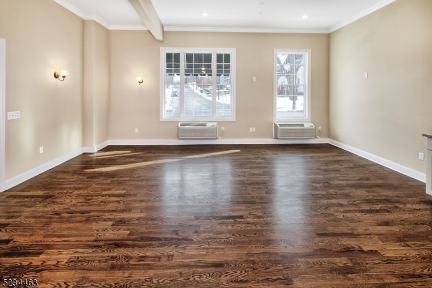 Huge, bright, and beautifully finished 2-bedroom, 2-bath apartment in the heart of Caldwell, just a few blocks from Bloomfield Ave. This home offers an expansive open-concept layout with space for a full dining area and a separate living room perfect for both everyday living and entertaining. The kitchen is a standout, featuring granite countertops, travertine backsplash, stainless steel appliances, and classic shaker cabinetry. The primary suite includes a private en-suite bath with tub and two large closets. The second bedroom enjoys its own full bathroom, ideal for guests or a flexible work-from-home setup. Additional highlights include hardwood floors, soaring 11-foot ceilings, oversized windows that flood the space with natural light, brand-new heat and air pump systems, abundant private basement storage for this unit only, washer/dryer in the basement, and two parking spaces a rare find in this location. Just moments from Downtown Caldwell's shops, restaurants, and everyday conveniences. Available 4/1/26.Just moments from Downtown Caldwell's shops, restaurants, and everyday conveniences. Available 4/1/26.