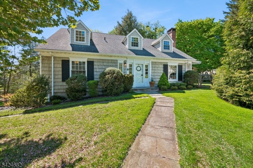 This exceptional 4-bedroom, 3.5-bath home offers a rare blend of timeless craftsmanship, thoughtful upgrades, and enduring quality. Originally built by renowned Short Hills builder George Lauber as his personal residence, the home has been meticulously maintained and thoughtfully improved over the years. The beautifully appointed kitchen, features semi-custom, inset cabinetry, leathered granite countertops, and a full suite of high-end stainless steel appliances. Hand-blown Juliska pendant lighting and designer finishes add warmth and sophistication. The first floor bathrooms are equally refined with Italian marble countertops and premium Hansgrohe fixtures. Throughout the home, quality and detail are evident, from the Pella windows with individual wood mullions (all windows have ben replaced) to the beautiful oak floors throughout. A spacious first-floor laundry room adds convenience, while the finished basement - with direct access to the over-sized garage - offers a playroom/recreation space. The unfinished attic space on the 2nd floor is already outfitted with gas and electric, which provides potential for future expansion. Set on a flat, private, fenced property, the outdoor space is equally inviting, featuring classic cedar shake siding (stained for durability), a Kwanza cherry tree (blooms each spring), and a charming herb garden with mint, sage, thyme, chives, oregano, and lavender. This is a home designed to be lived in and loved for years to come.