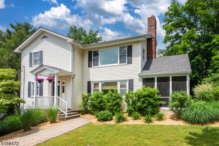 Stunning 4 bedroom 3 bath colonial in the heart of Caldwell. Hardwood floors throughout and lots of windows. Spacious living room with wood-burning fireplace. The kitchen offers granite countertops, stainless steel appliances and a breakfast bar and is open to the dining room. A bedroom (currently used as an office) and a full bathroom complete the main floor. Upstairs is a master with a walk-in closet and en-suite with a double vanity and stall shower. Two additional bedrooms, a full bathroom as well as the laundry area complete the floorplan. The basement can be used as a family room or playroom and has a large separate storage area, the garage entrance and utility room. The exterior boasts a flat backyard, a large paver patio as well as a screened-in side porch. Close to downtown shopping and dining and a NYC bus stop down the street, this house is a must see.