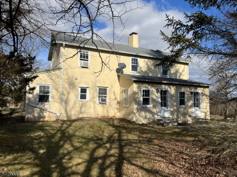 This charming 4 bedroom, 2.5 bath restored 19th century farmhouse sits on 9 scenic acres adjoining 700 acres of public land for hiking and trail riding. The sunny living space has been renovated throughout. The first floor features a spacious kitchen opening onto a stone patio, dining room, living room, cozy den(bedroom) and two sun porches. Upstairs you'll find three roomy bedrooms, a new full bath with heated floor, and a cozy sitting area. Closets abound! Outside, the three renovated outbuildings include a large open barn with hay loft, a milk house, and a horse barn with stall, adjacent tack room, hay storage, and adjoining paddock, all with plenty of room for expansion.  Like the house, all outbuildings have replaced roofs and electrical and other improvements. Two large, fenced pastures with plenty of room for run-in sheds and a 20m X 40m dressage arena make this property ideal for horse-lovers!  This home features spectacular sunset views out back and incredible double rainbow views out front. Here one can enjoy 709 acres, yet only tend to a magnificent 9!  Don't miss this opportunity to have a piece of the country with easy access to shopping and restaurants.