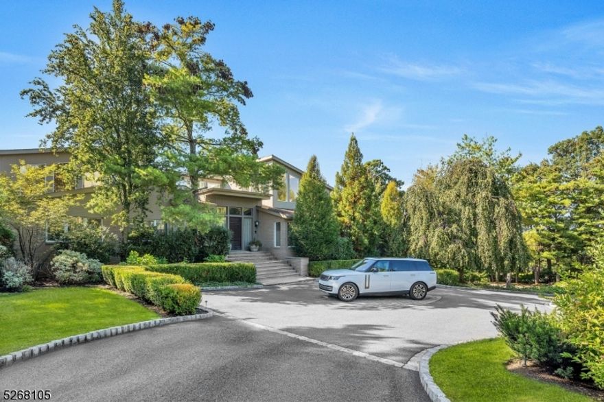 Tucked away in Livingston's Chestnut Hill neighborhood, this sprawling 15,000-square-foot residence is a testament to refined luxury and comfort. As you step into the grand entrance, prepare to be surprised by what awaits within where soaring ceilings, meticulous attention to design and exceptional craftsmanship all converge to tell a story of sophistication and grandeur. The heart of this home is a culinary enthusiast's dream kitchen, effortlessly flowing into dining and leisure areas designed for both lavish and cozy gatherings. The piece de resistance is the serene first-floor primary suite which offers complete privacy with an abundance of natural light, a sumptuous bath with a focal and decadent soaking tub, a boutique-inspired dressing room of unparalleled elegance and a spacious sitting room/office, all designed to pamper and indulge the senses. Beyond the personal quarters, the home boasts a voluminous living room, fireside library, three inspiring office spaces, 4 fireplaces, 5-car garage and a lower-level entertainer's dream with game room, recreation room, home theater, exercise room, indoor sports court, second full kitchen and cabana with sauna. And while all of these indoor amenities make this a home where friends will always gather and every exterior will pale in comparison, an expansive outdoor deck and free-form pool are available for those warm summer days. This bespoke residence is most certainly where the old adage "There's No Place Like Home" originated.