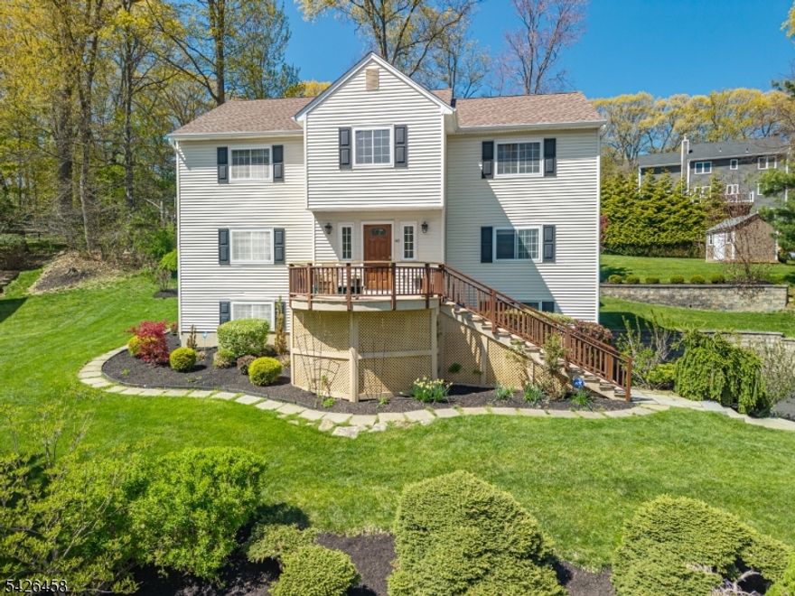 Beautifully maintained home in desirable Cobblestone Crossing on Randolph's east side with city water and sewer. Set on a private, landscaped lot with mature trees, stone walls, patio with lighting and maintenance-free deck in addition to front sun porch with views.  This house enjoys abundant natural sunlight with its southern exposure. Spacious family room opens to a renovated kitchen featuring granite countertops, Medallion maple cabinets with under-cabinet lighting, center island with wine storage, GE stainless steel appliances which includes three ovens and built-in ceiling speakers. First floor complete with newly updated powder room.  Upstairs offers an oversized primary suite with two walk-in closets and a large bath as well as three additional bedrooms all complete with hard wood flooring. Additional second floor beautifully updated custom bathroom.  Finished basement, complete with heat provides additional space for playroom, office or exercise room as well as additional storage. Additional home features include: 3 zone underground sprinkler system, frost-free hose bibs, outdoor gas line for grill, ADT security system and 12' x 8' storage shed. Major updates include: furnace 2023, A/C 2024, attic fan 2026 and Timberline High Definition Shingle roof. This pristine home is conveniently located near downtown Morristown with direct NYC train service.  This must see property provides access to top rated parks, recreation and sought after Randolph schools.