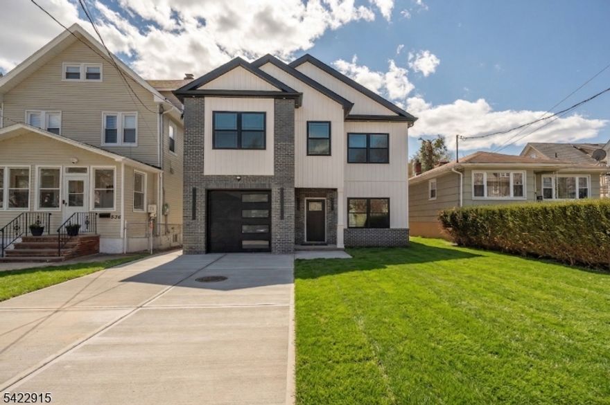 Brand new 2,950 sq. ft. of living space.4/5 bedroom 3 1/2 baths Colonial in the Elmora Section of Elizabeth. 5 year tax abatement. 10 Year Home Warranty.Open Floor Concept. 5th Bedroom on ground level could be used as an office or in-law suite with full bath. All bedrooms have their own walk-in closet. 2 HVAC Units. Electric cars charger in garage. Perfect location for shopping, schools, houses of worship, airport and highways. New York bus at corner.