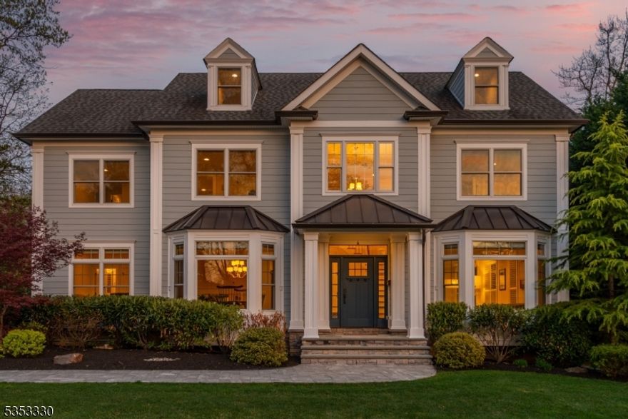 This stunning luxury residence boasts many features designed for both comfort and elegance. Beautifully landscaped with mature plantings on a generous .46-acre level lot on a cul de sac, this property ensures your serene privacy while still being close to all amenities. As you enter through the grand two-story foyer, you're greeted by soaring 9 ft ceilings and exquisite custom millwork that sets the tone for the entire home. The coffered ceilings in the living areas add an extra touch of sophistication as well as built in speakers for sound interior and exterior, floor to ceiling custom transom windows, remote custom window treatments, premium oak flooring throughout and spacious open floor plan. The chef's kitchen is outfitted with a Wolf 8 burner range, Wolf 3rd wall oven, pot filler, a Subzero refrigerator, and a large center island and stunning quartz countertops and backsplash elevate the space.The family room is centered around the gas fireplace, overlooking the expansive paver patio, perfect for outdoor gatherings and yard with room for a pool. With 5 bedrooms ensuite, everyone will enjoy their own personal retreat. The Primary suite is a true sanctuary, featuring elegant tray ceilings, a luxurious marble bathroom with a soaking tub, marble stall shower, private water closet, and a spacious walk-in closet. The finished basement has high ceilings, a full bath, an additional bedroom, and a designated room ready for a wine cellar. 3 car garage.Generator for peace of mind.