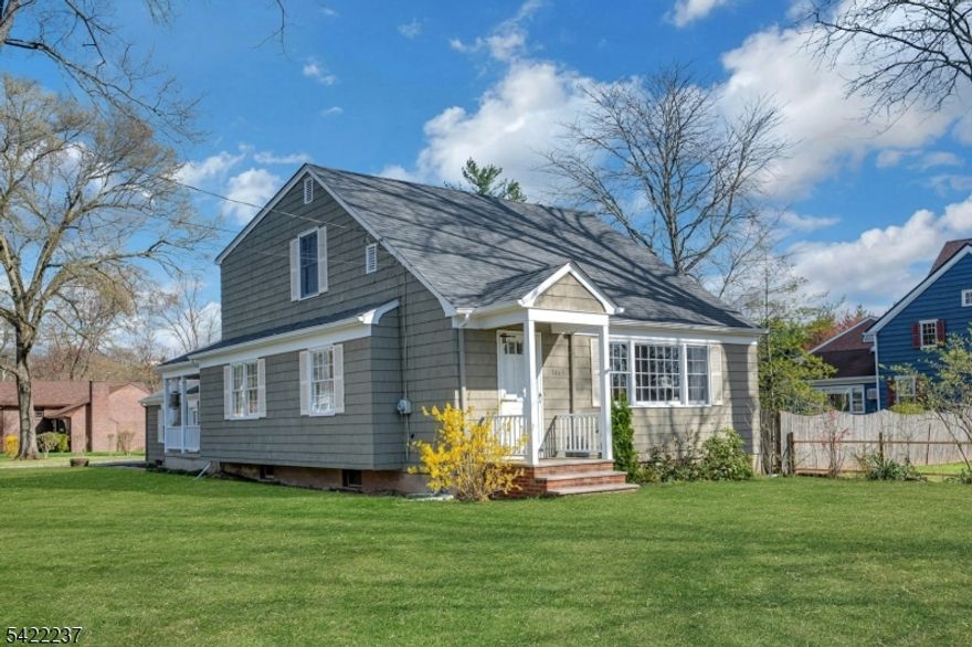 Welcome home to this charming expanded Cape on .35 acre corner lot in an excellent section of sought-after New Providence, ideally located near commuting options (6 min drive to the train and just one block to the bus to Port Authority), short walk to the town recreation complex (pool, Jaycees Park, sports fields, tennis courts, community garden), the acclaimed New Providence HS/MS campus, and vibrant downtown restaurants & shops.  Enjoy early mornings, lovely afternoons and evenings on the spacious, airy covered side porch which ushers you in, with a charming fireplace and billowing curtains.  The original kitchen is sunny and opens onto sun drenched dining room and living area.  Two large bedrooms on the first floor and another two on the second, with full baths on both floors.  An enormous basement, half finished and used as a den (with another working fireplace) and the other half as large work space area for laundry and plentiful storage.  The garage fits two cars, with abundant space to spare.   Ideal oversized flat lot with endless potential for renovation, customization and/or significant expansion.